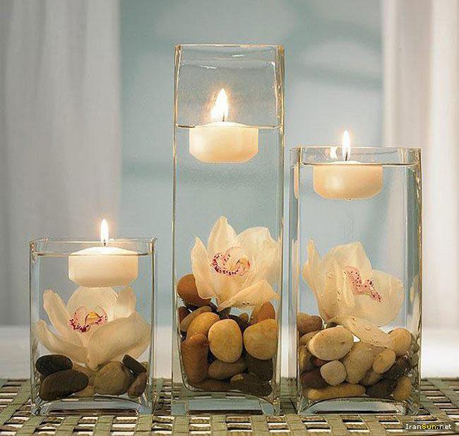 галька в стаканах с водой и плавающими свечами - разное - оригинал