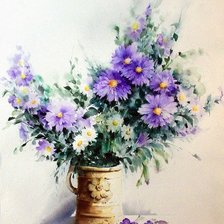 голубые уветы в глиняной вазе