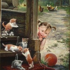 Девочка играет с котятами