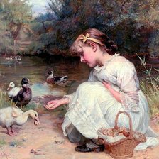 Dziewczynka karmiąca kaczki