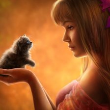 Девушка с цветами в волосах и с маленьким котенком в руках