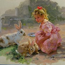 Girl feeding rabbits
